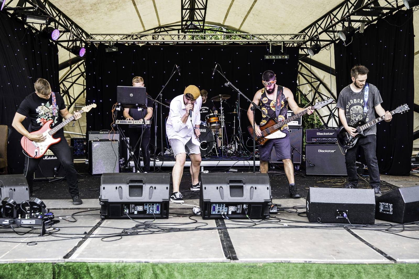 blackmarket 5 piece band on the stage