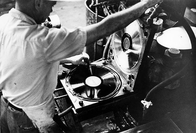 Vinyl pressing plants with man at work