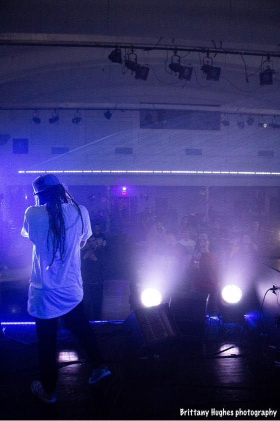 Sir Mike standing on a stage