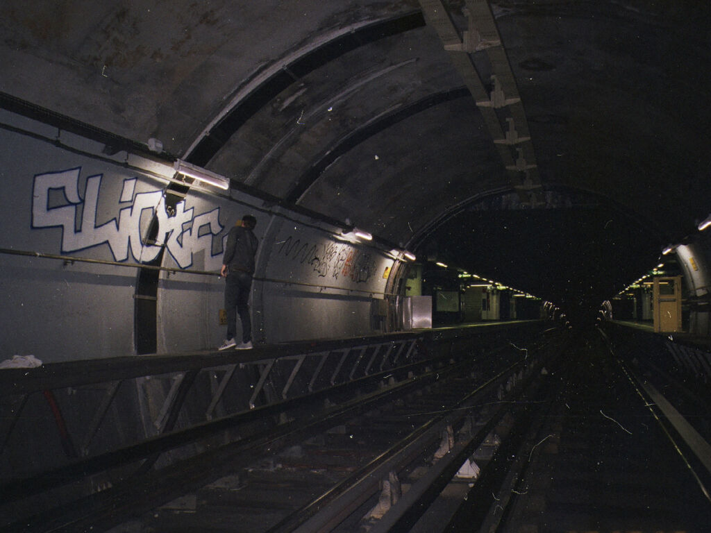 eliote painting in a tunnel